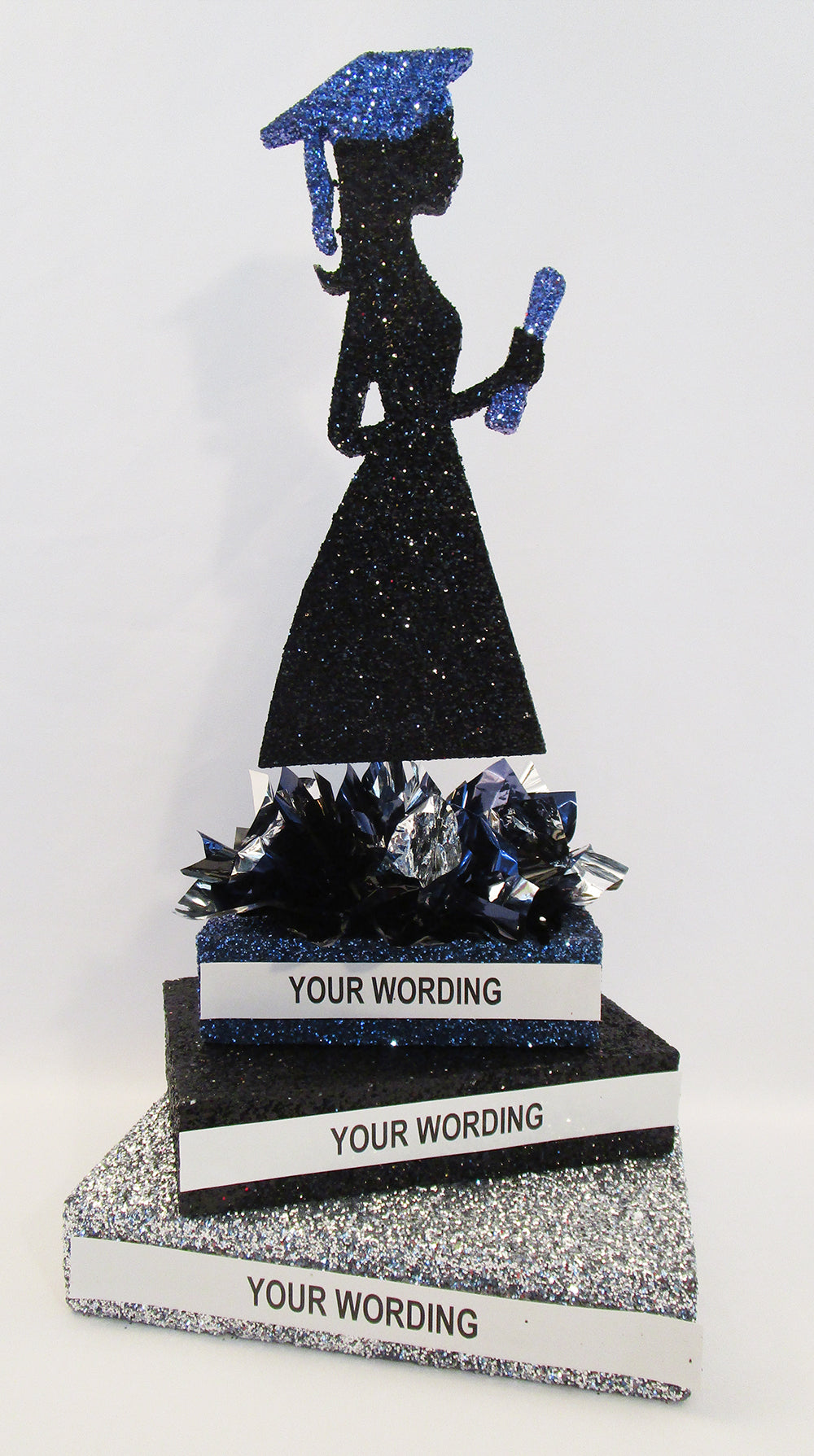 Grad Girl Silhouette on Stack of Books