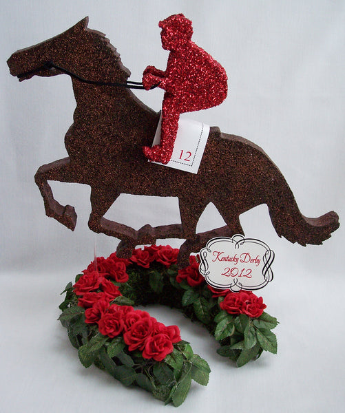 Kentucky Derby themed centerpieces with horse, jockey, trophy & roses.