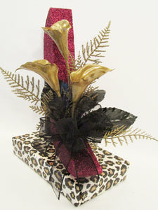 Maroon and gold high heel shoe centerpiece - Designs by Ginny